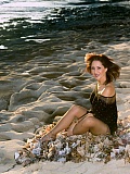A photo shoot with gorgeous aged lady Rony is posing on the sea beach